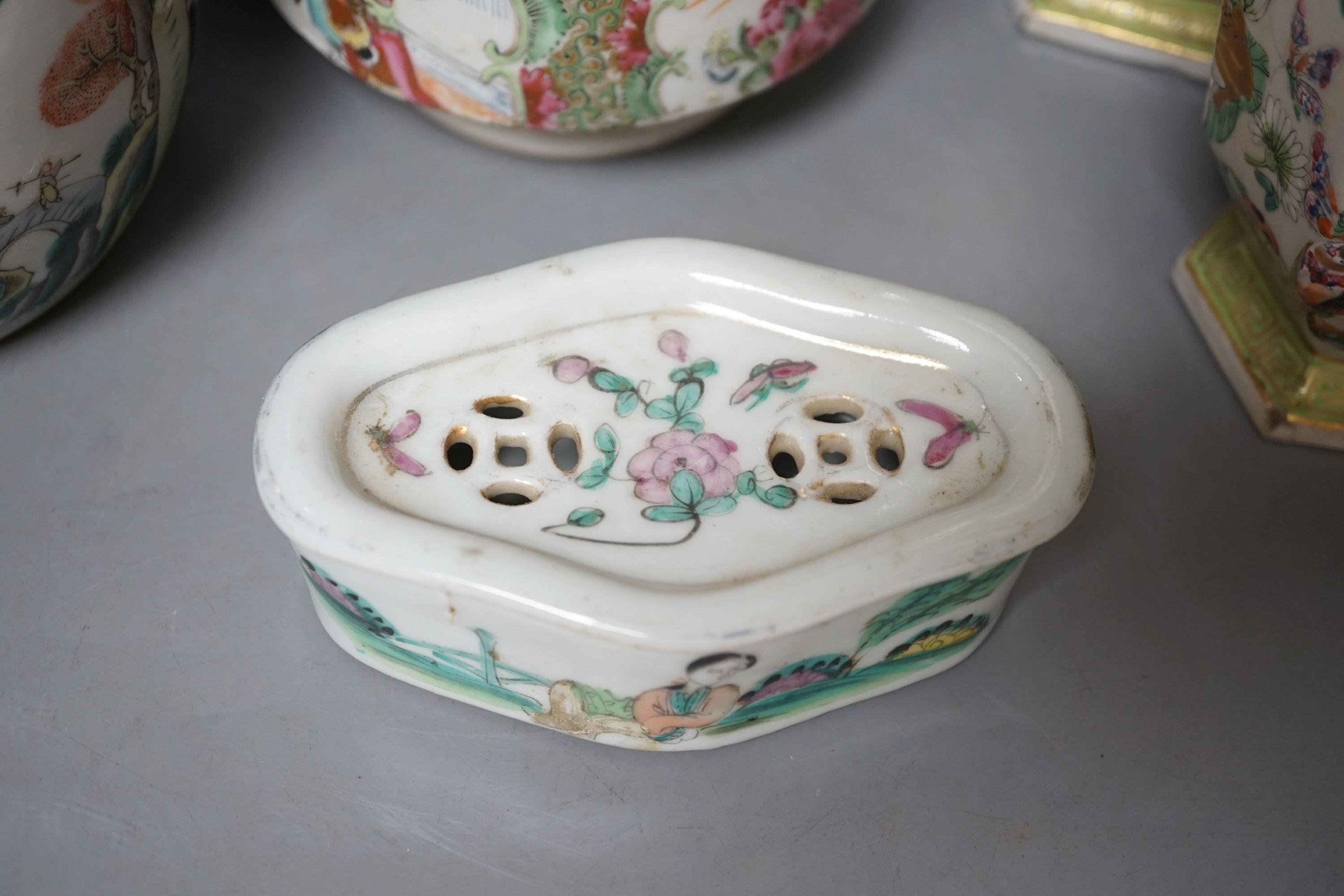 A group of 19th-century Chinese enamelled porcelain vessels, to include a jar, a pair of hexagonal vases, a pot and a cricket cage, Pair of vases 22cm high.